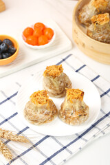 Chinese Siu Mai Dumplings with Salted Egg Yolk and Pork Filling Traditional Dim Sum