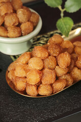 Dried Longan Fruit from Yunnan China in Traditional Wooden Spoon and Bowl Display