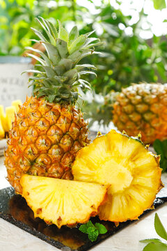 Fresh Zhanjiang Pineapples with Golden Sliced Flesh Display on Slate Board Tropical Fruit