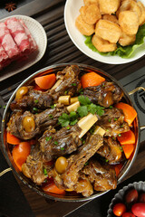 Braised Lamb Ribs with Vegetables in Cooking Pot - Traditional Hot Dish with Side Appetizers