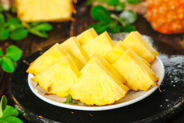 Fresh Sliced Pineapple with Sweet Golden Flesh on White Plate - Tropical Fruit Ready to Eat
