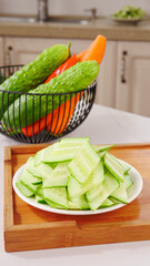 Fresh Sliced Cucumber and Mixed Vegetables in Modern Kitchen Setting
