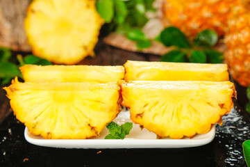 Fresh Pineapple Slices with Mint Garnish - Tropical Fruit Display Zhanjiang Xuwen