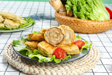 Crispy Fried Spring Rolls with Fresh Vegetables on Rustic Kitchen Table