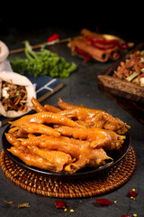 Spicy Marinated Chicken Feet Traditional Asian Food Delicacy on Dark Background