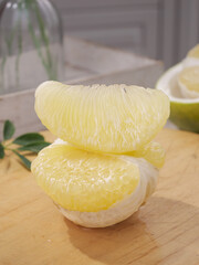 Fresh White Pomelo Segments from Thailand on Wooden Board - Tropical Citrus Fruit