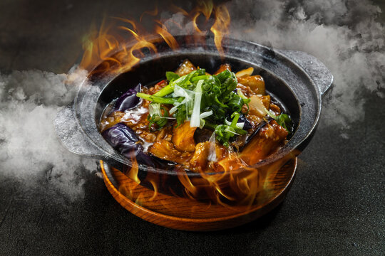 A sizzling medley of steam and flame, infused with bold Chinese aromas&mdash;wok-fried stir-fries, street-style claypot dishes, and the irresistible fragrance of fish-flavored eggplant bubbling in a hot pot