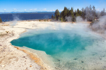 Steam Rising from Surging Spring in West Thumb Geyser Basin on Yellowstone Lake, Yellowstone National Park in Wyoming in Early Fall.