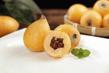 Fresh Loquat Fruits from Sichuan China - Traditional Alpine Fruit with Seeds and Mint Garnish