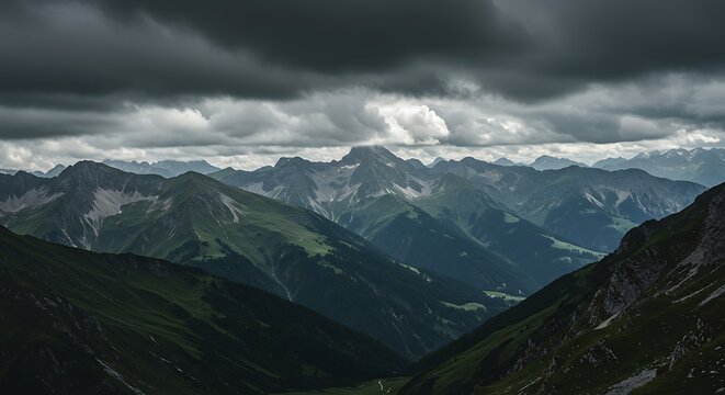 Dramatic mountain range view under a moody cloudy sky landscape scenery