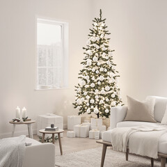 A bright white living room with a simple Christmas tree decorated with white ornaments