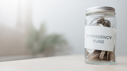 emergency, fund, savings, cushion, risk, management, finance, reserve,  finance Glass jar labeled Emergency Fund filled with coins, symbolizing financial safety, savings, and personal risk management.
