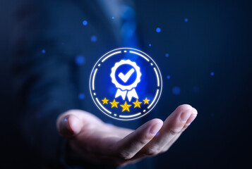 Business quality assurance concept with digital badge, check mark and five stars above hand, representing trust, certification, customer satisfaction, premium service and high standard guarantee.
