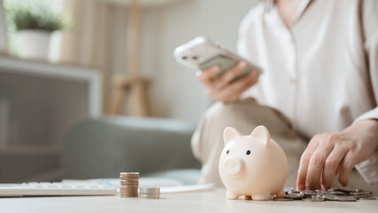 refund, pending, payment, processing, finance, ecommerce, transaction, status, review, Piggy bank with coins and person using smartphone represents refund, pending payments, and financial processing.