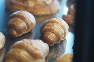 Croissants baked to golden perfection in a bakery display