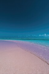 Fototapeta premium Serene beach scene with soft pink sand meeting vibrant turquoise