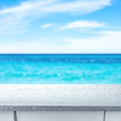 Table overlooking turquoise sea and blue sky, blurred distance