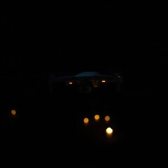 Drone Night Flight with Lights Below.