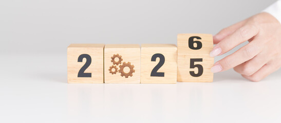2025 year change to 2026 year block with gear icon. Business Process, Team, teamwork, Goal, Target, Resolution, strategy, plan, Action, motivation, change, brainstorm and New Year start concepts