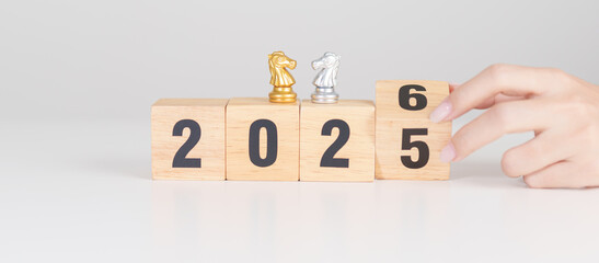 Happy New Year 2025 change to 2026 year block with horse chess. Year of the Horse, animals of the Chinese zodiac, horoscope, success and good fortune