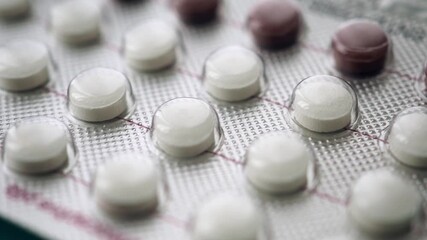 closeup of birth control pills on a table 