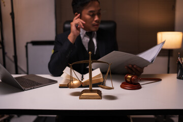 Male lawyer working on legal matters in a law office	
