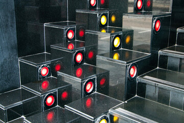 ฺBlack stairs are interior decorated with red and yellow LED lights for beautiful entrance. Elegant stairs with step lighting, combining natural texture and modern illumination.