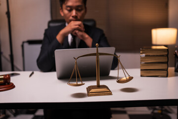 Male lawyer working on legal matters in a law office	