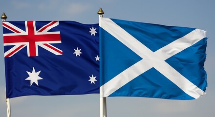 Flags of australia and scotland waving against a blue sky background