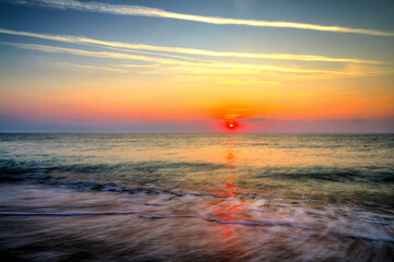 Beautiful summer sunrise over the beach