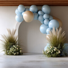 Soft blue and beige balloon arch decorates modern archway with ornamental grass and white flowers, creating festive and elegant atmosphere