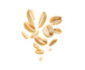 Peeled peanuts levitate on a white background