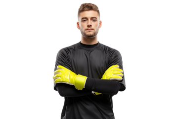 A young male soccer goalkeeper wearing a black jersey and yellow gloves, standing with his arms crossed, isolated on transparent background