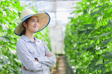 Farmer girl is smiling happily looks at the crops she has planted.