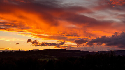 peace. A breathtaking sunset sky panorama with vibrant warm hues and glowing clouds. inspiring travel planning, travel magazines, designed for travel destination branding, inspires travel planning.
