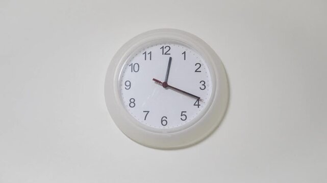 Time lapse on a modern wall watch white clock go forward. clocks shows times moment concept occasion