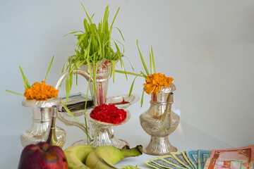 Tika and Jamara placed in a silver utensil with barley sprouts, money, and fruits for the Vijaya Dashami ceremony during Dashain festival in Nepal.