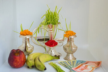 Tika and Jamara placed in a silver utensil with barley sprouts, money, and fruits for the Vijaya Dashami ceremony during Dashain festival in Nepal.