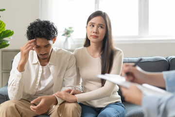 Spouses relationship consultant concept, Close-up hands of psychologist holding pen and note during...