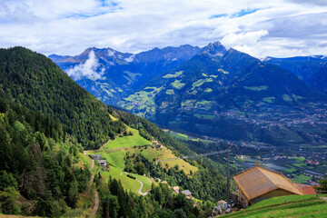 Mountain panorama with summits Hirzer and Ifinger in the clouds in South Tyrol, Italy