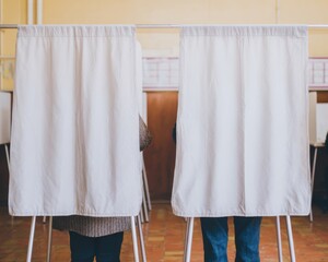 Authentic Voting Booth Scene with Two People Casting Ballots Premium Electoral Privacy and Confident Decision-Making for Political Campaigns and Social Media