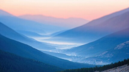 Obraz premium Mountain valley at dawn with soft colors and misty landscape view