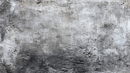 Obraz premium An old weathered concrete wall with a rough and uneven surface showing dark and light gray textures