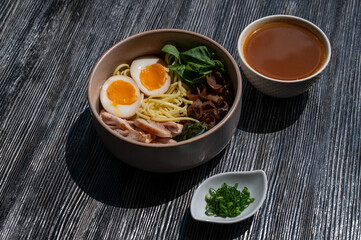 Ramen soup in a cafe. Broth separately. 