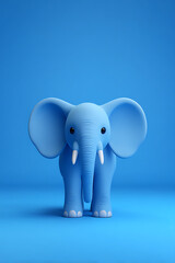 Fototapeta premium A cute blue elephant figurine stands against a solid blue background, ideal for playful decor