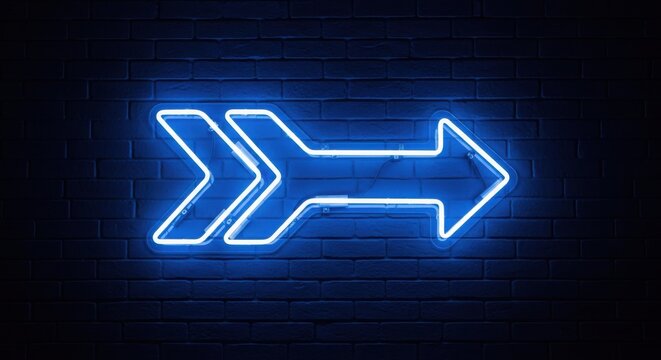 Blue neon arrow sign glowing on a dark brick wall at night