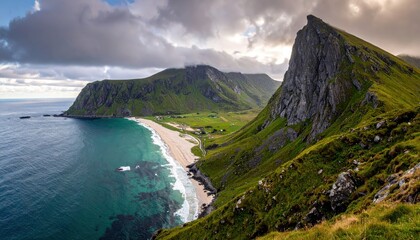 Fototapeta premium Panoramic view of a stunning coastline featuring a pristine sandy beach with crystal clear turquoise waters, nestled between majestic green mountains under a dramatic cloudy sky, creating a scenic...