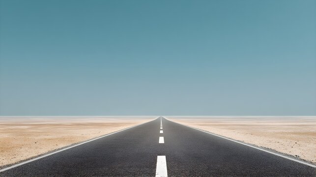 Endless desert highway asphalt road journey towards horizon under vast blue sky transportation concept landscape view