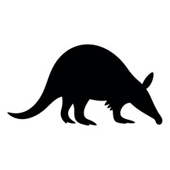 Silhouette of an aardvark foraging with its snout low to the ground
