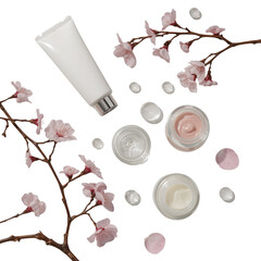 Minimalist cosmetic product presentation amidst blossoming branches against sleek black backdrop